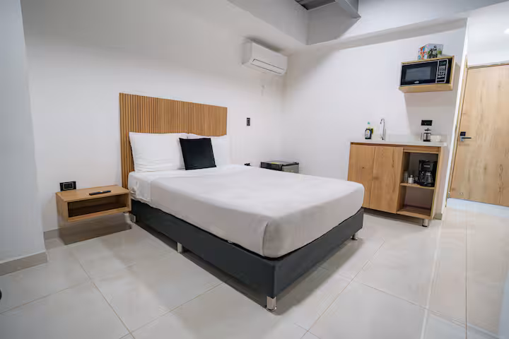 Apartamento tipo estudio con cama doble y aire acondicionado para estadías cortas